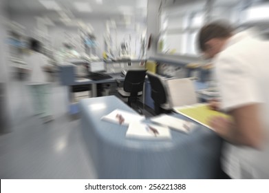 Blurred Figures Of Busy People With Medical Uniforms