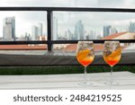 Blurred Financial district Skyline and Spritz Cocktails: A Perfect Pairing