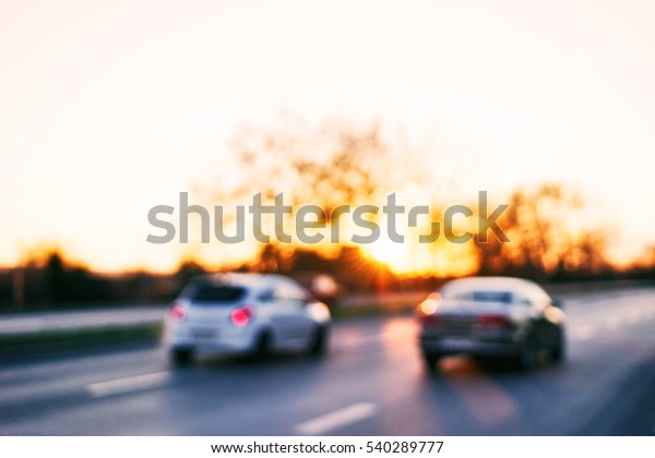 Blurred flow of cars on highways at sunset background.\
Bokeh basic background for design\
                          \
