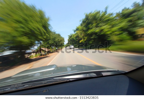 Blurred focus on car with slow
shutter speed. driver blurred be drunk and fast speed
concept.