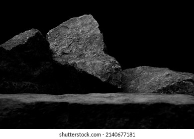 A Blurred Foreground Rock Shelf for Product Display  Showing Selective Focus to the Background Stones and Natural Worn Texture and Close Detail to the Ancient Small Boulders 