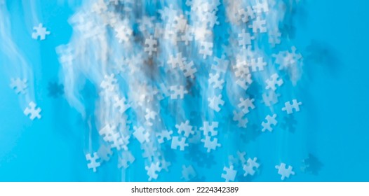 Blurred Fuzzy Black And White Jigsaw Pieces On Blue Background