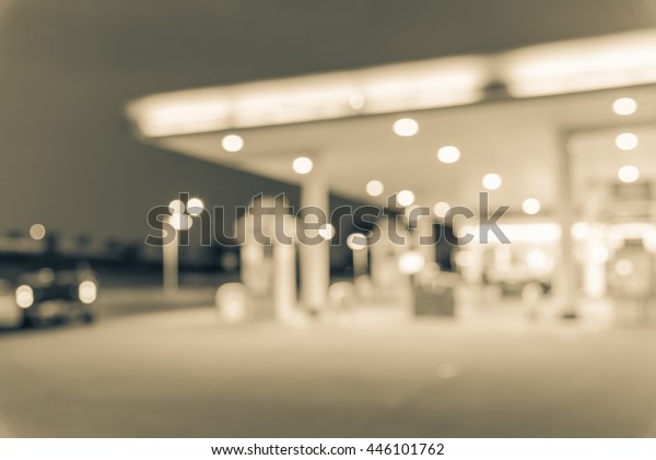 Blurred of gas station at blue hour. Defocused, out
of focus gas station and convenience store in evening twilight.
Abstract blur petrol station background with copy space. Vintage
filter look.