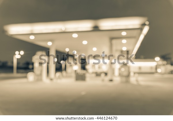 Blurred of gas station at blue hour. Defocused, out\
of focus gas station and convenience store in evening twilight.\
Abstract blur petrol station background with copy space. Vintage\
filter look.
