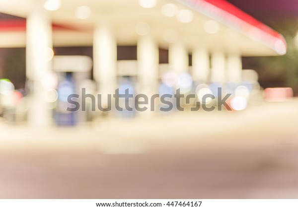 Blurred
of gas station at night. Defocused, out of focus gas station and
convenience store in evening. Abstract blur petrol station
background with copy space. Vintage filter
look.