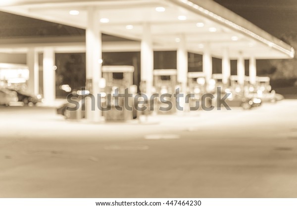 Blurred\
of gas station at night. Defocused, out of focus gas station and\
convenience store in evening. Abstract blur petrol station\
background with copy space. Vintage filter\
look.