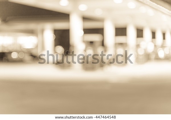 Blurred
of gas station at night. Defocused, out of focus gas station and
convenience store in evening. Abstract blur petrol station
background with copy space. Vintage filter
look.