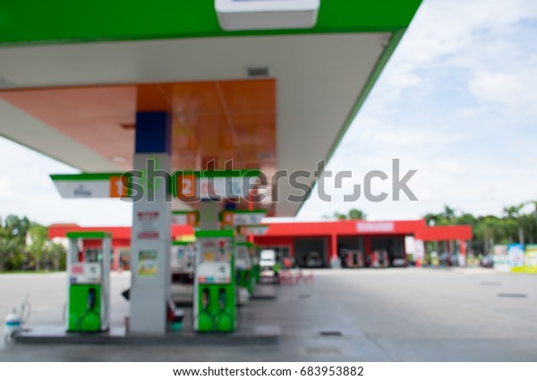 Blurred gasoline\
station with beautiful blue\
sky