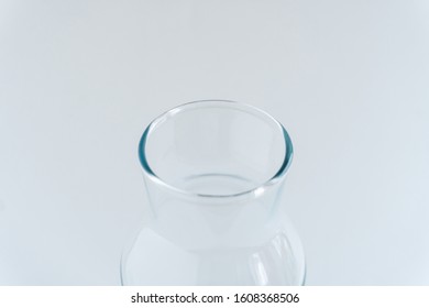 Blurred Glass Bottleneck At Gray Monochrome Background. Zero Waste Storage. Minimalist Lifestyle. Copy Space.