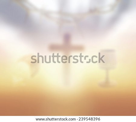 Blurred glass of wine and Loaf of bread with crown of thorns and the cross on a sunset in eucharist