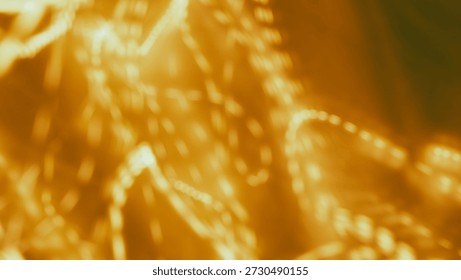 Blurred golden light patterns create an abstract background with ample copy space