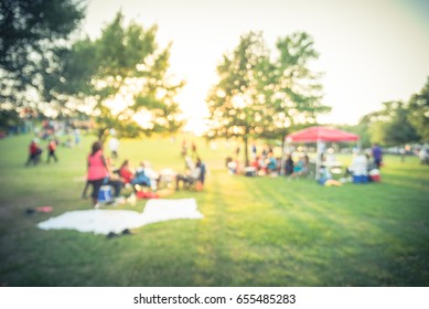 Blurred Group Of African American Friend, Family Members Enjoy Free Outdoor Music Festival, Open-air Concert Held In Public Park At Houston. Audience Sits On The Chairs, Grass, Open Tent. Vintage Tone