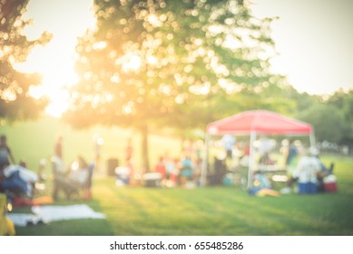 Blurred Group Of African American Friend, Family Members Enjoy Free Outdoor Music Festival, Open-air Concert Held In Public Park At Houston. Audience Sits On The Chairs, Grass, Open Tent. Vintage Tone