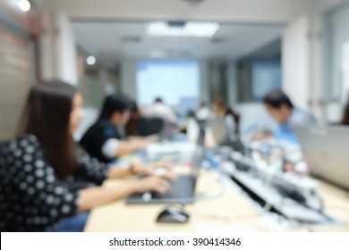 Blurred Group Of Employee Thoughtful Programming Code System In Information Technology Department.