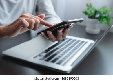 Blurred hand of woman is touch, slide, press on screen of phone for check e-mail, news, prepare of  meeting presentation, get promotion information for shopping online or operation of internet banking - Shutterstock ID 1698190303