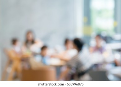 Blurred Happy Family On Kitchen Restaurant Background