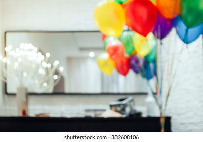Blurred hazy background image with balloons and presents in a white design room with no focus - Shutterstock ID 382608106