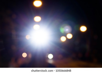 Blurred Headlamp Runner With Light Flares,Night Run Safety Concept.