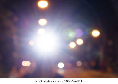Blurred Headlamp Runner With Light Flares,Night Run Safety Concept.