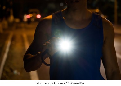 Blurred Headlamp Runner With Light Flares,Night Run Safety Concept.