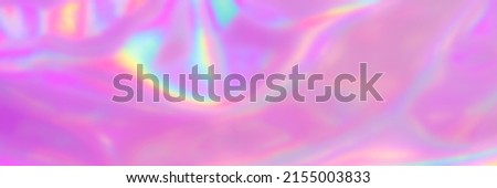 Blurred Holography abstract background in blue pink colors. Banner. Holographic colour wrinkled pearlescent foil. Holographic iridescent rainbow fabric abstract background.