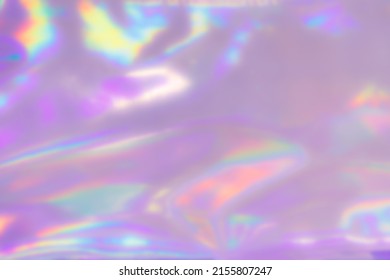 Blurred Holography Abstract Background. Holographic  Wrinkled Pearlescent Foil. Holographic Iridescent Rainbow Fabric Abstract Background.