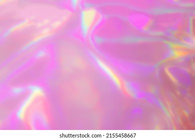 Blurred Holography Abstract Background In Pink Colors. Holographic Color Wrinkled Pearlescent Foil. Holographic Iridescent Rainbow Fabric Abstract Background.