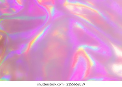 Blurred Holography Blue Pink Abstract Background. Holographic Color Wrinkled Pearlescent Foil. Holographic Iridescent Rainbow Fabric Abstract Background.