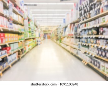 Blurred Home Cares Product On Display At Retail Store In America. Defocused Trash Bags, Light Bulbs, Paper Tower, Air Freshener, Cup, Plate, Cleaning Supplies, Bath Tissue, School Supplies Aisle