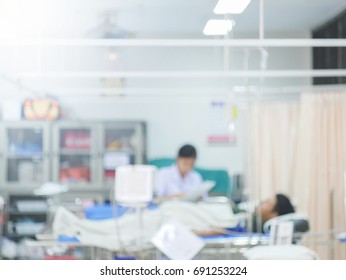 Blurred Hospital Background -abstract Blur Doctors And Nurses Are Busy With The Treatment Of Many Sick People In Emergency Or In Patient Room Background.