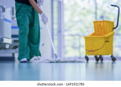 Blurred hospital images,Clean and sanitize, Cleaner, Hospital cleaning,Cleaning the hospital floor. Floor care and cleaning services with washing mop in sterile factory or clean hospital.