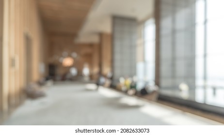 Blurred Hotel Or Office Building Lobby Blur Background Interior View Toward Reception Hall, Modern Luxury White Room Space With Blurry Corridor And Building Glass Wall Window