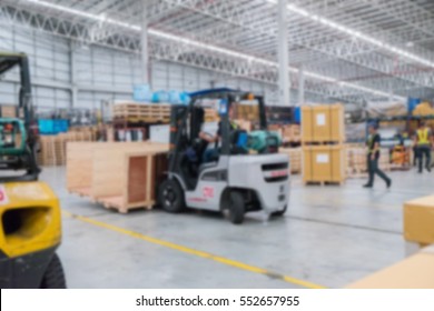 Blurred Huge Distribution Warehouse And Cardboard Boxes On Pallet.  Freight Transportation And Delivery Concept.