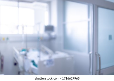 Blurred ICU Room In A Hospital With Medical Equipments And Patient.