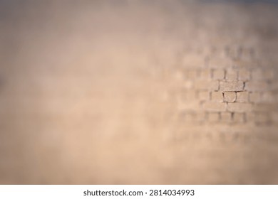 Blurred image of an adobe brick wall