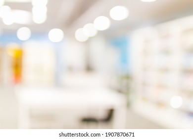 Blurred Image For Background Of Many Books On Bookshelf In Library.