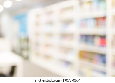 Blurred Image For Background Of Many Books On Bookshelf In Library.