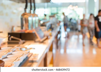 Blurred Image For Background Of People In Buffet Line At Restaurant