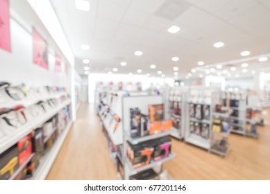 Blurred Image A Beauty Store With Variety Of Hair Salon Products On Display In US. Aisle, Shelf Of Hair Care Tools, Shampoo & Conditioner Treatment, Hair Color, Hair Styling Tools, Brushes And Combs