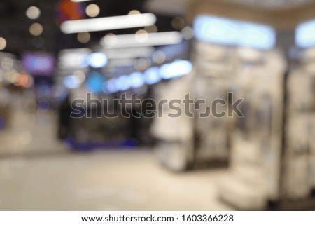 Blurred image a beauty stores with variety of prestige & mass cosmetics, makeup,
