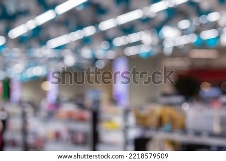 Blurred image a beauty stores with variety of prestige and mass cosmetics, makeup, fragrance, skincare, bath and body, hair care tools and salon, nails, tools and brushes products on display