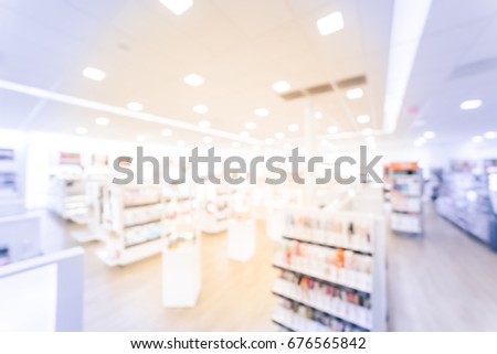 Blurred image beauty stores with variety of prestige & mass cosmetics, makeup, fragrance, skincare, bath & body, hair care tool & salons, nails,  tools, brushes products on display in US. Vintage tone