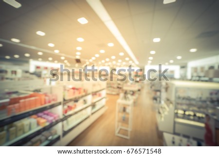 Blurred image beauty stores with variety of prestige & mass cosmetics, makeup, fragrance, skincare, bath & body, hair care tool & salons, nails,  tools, brushes products on display in US. Vintage tone