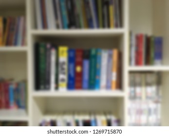 Blurred image of bookshelf. Knowledge background.