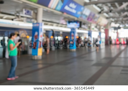 Blurred image of BTS Siam Station in Bangkok Thailand in rush hour