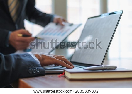 Blurred image, businessman is talking to an investment advisor to plan a real estate investment and discuss the budget to borrow from a financial institution to keep the business running smoothly.