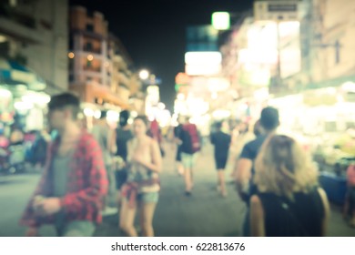 Blurred Image Of Busy Night Life In The City. Defocused Photo Of Night Lights Of The Famous Ko San Road In Bangkok, Thailand.