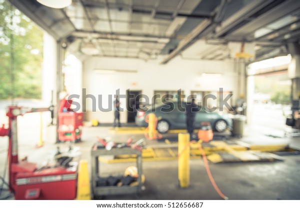 Blurred image of car in auto shop. Defocused
background of modern repair shop. Small car oil change service
station at Little Rock, Arkansas, US. Repair shop with working auto
mechanic. Vintage
filter