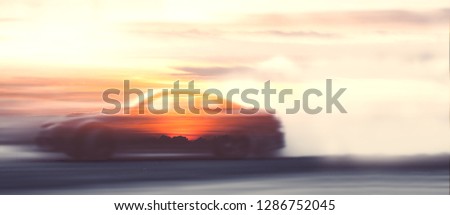 Blurred of image car drifting battle with sky and cloud, Double exposure.