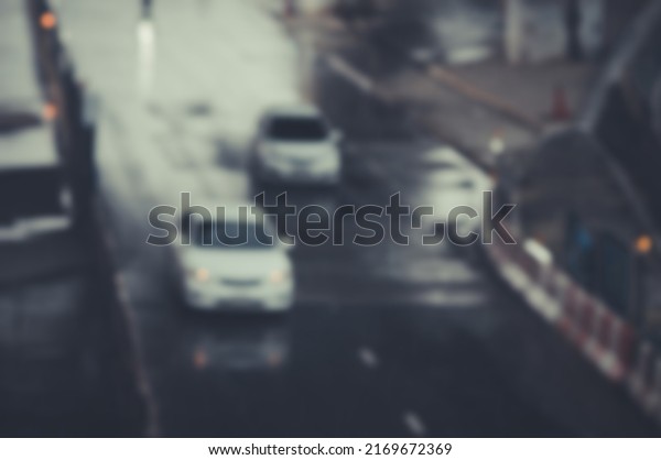 Blurred image of a car
driving on the road and bokeh from lens melting for wallpaper,
backdrop and design.